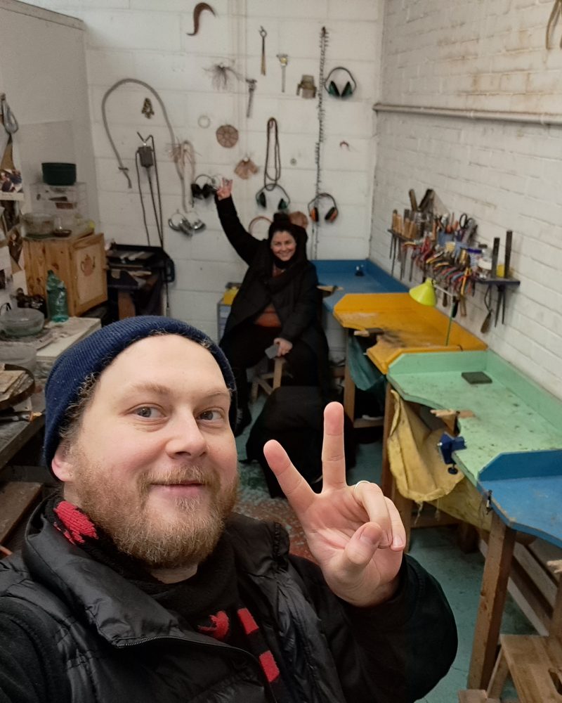 Jack giving a peace sign in a jewellery workshop