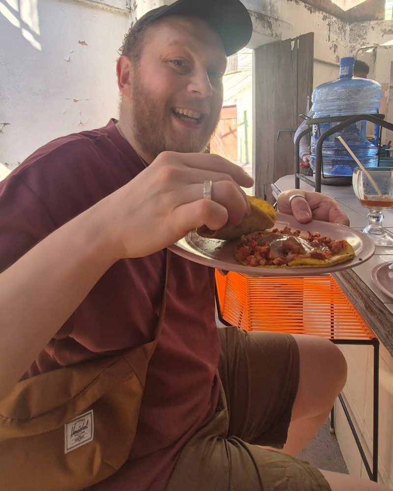 Jack grinning over a plate of tacos